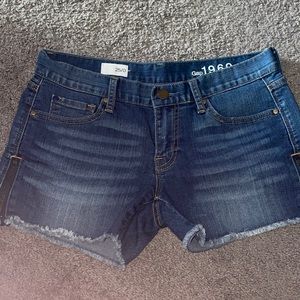 GAP jean shorts with zippers on side.